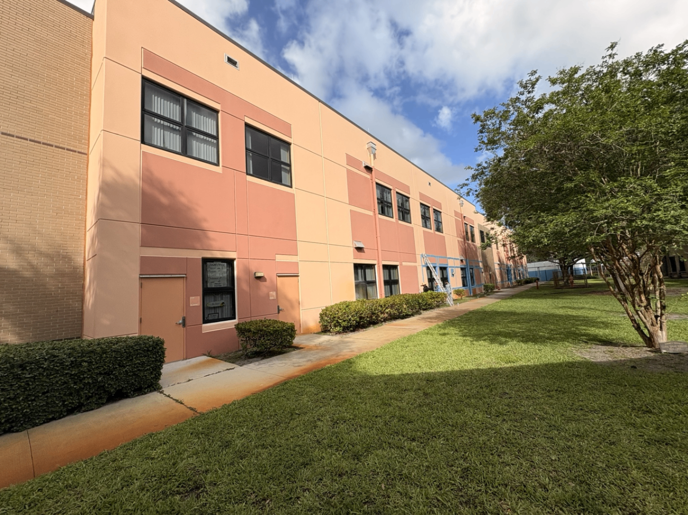Commercial building exterior before repainting in South Florida